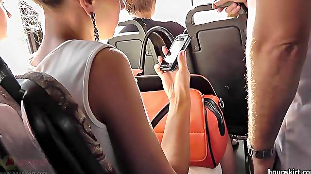 Hot upskirt in the bus with slender brunette