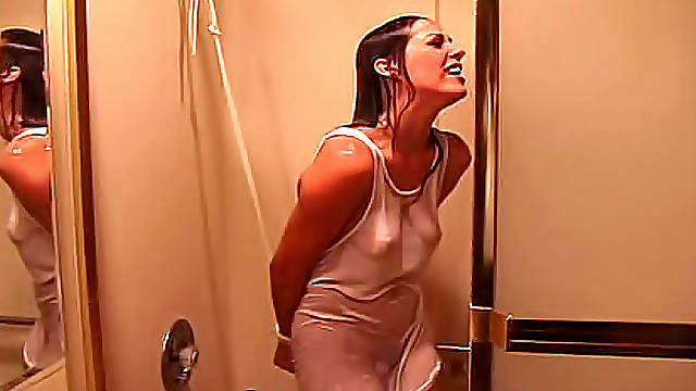 Whimsical and tied brunette is taking shower