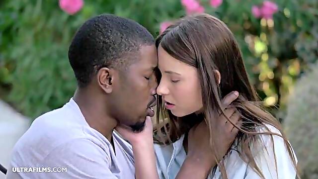 Two men are fucking a slender white model Taylor Sands in the garden