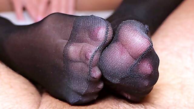 Dark black stockings filling with double cum footjob