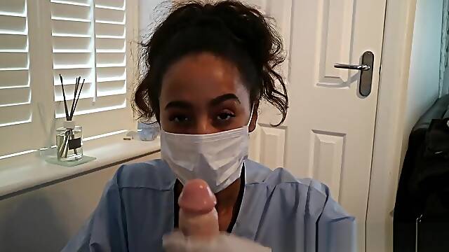 SEXY BLACK BRITISH NURSE GIVES HANDJOB WEARING SURGICAL MASK AND GLOVES