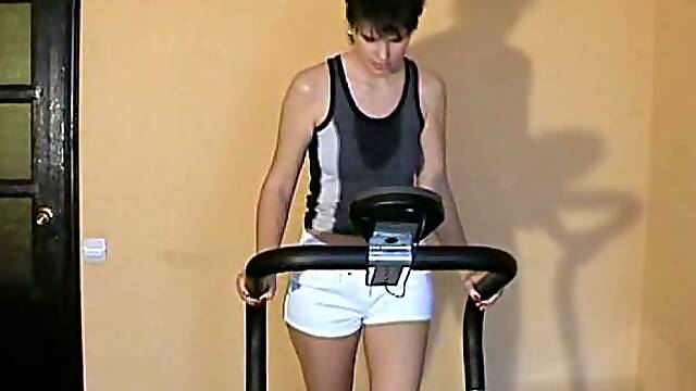 Lovely short haired brunette lady naked on the treadmill