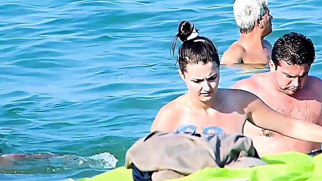 Fresh young nudist chicks caught on a voyeur camera