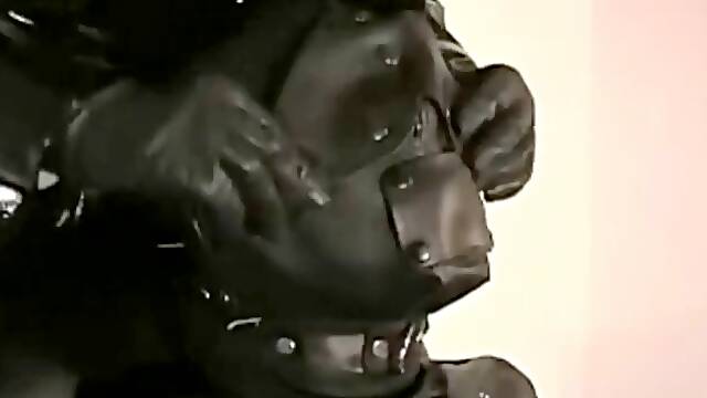 Leather slave muzzled
