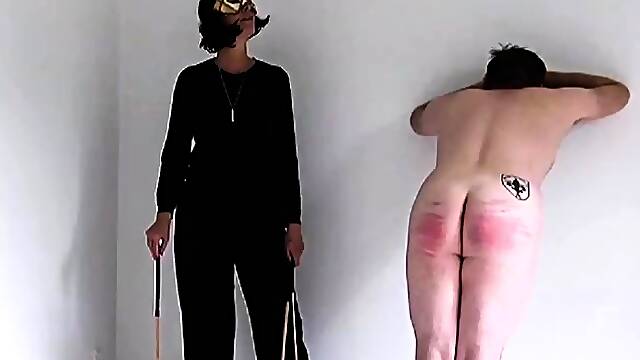 Pitiful slave spanked hard by merciless MILF mistress