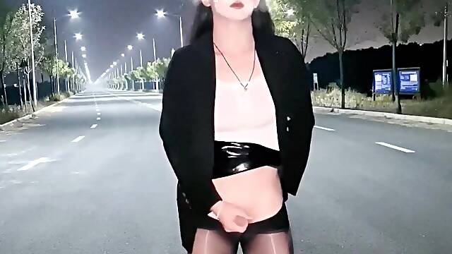 Chinese she-male wanks and finishes off in the middle of the road