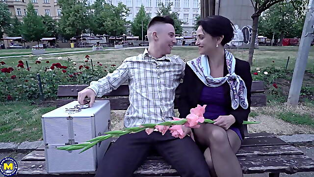 Experience the irresistible allure of a mature MILF as she receives a surprising gift from her...