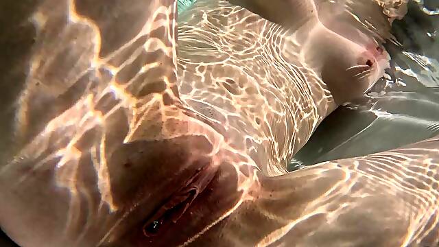 Skinny teen Mary Moon wanking her pussy by the pool in sensual solo action