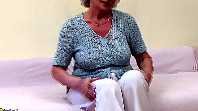 Mature Blonde granny fingering her hairy pussy seductively