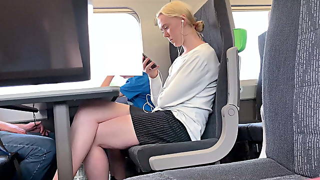 Blonde with beautiful legs on the train