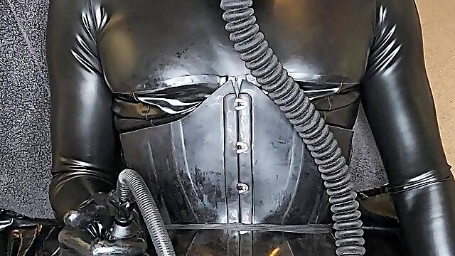 Latex doll training, gasmask, cock pump, plugged